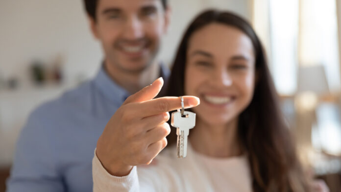 Close,Up,Young,Excited,Couple,Showing,Keys,In,Hands,To Become a homeowner